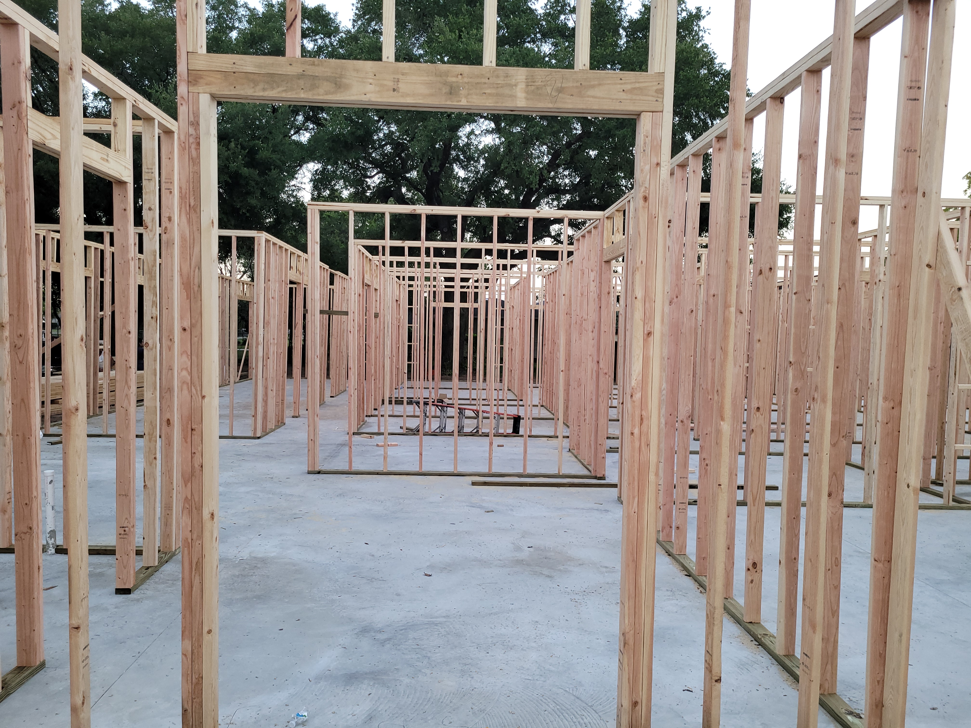 Wood stud wall framing on concrete slab at Doerre office building
