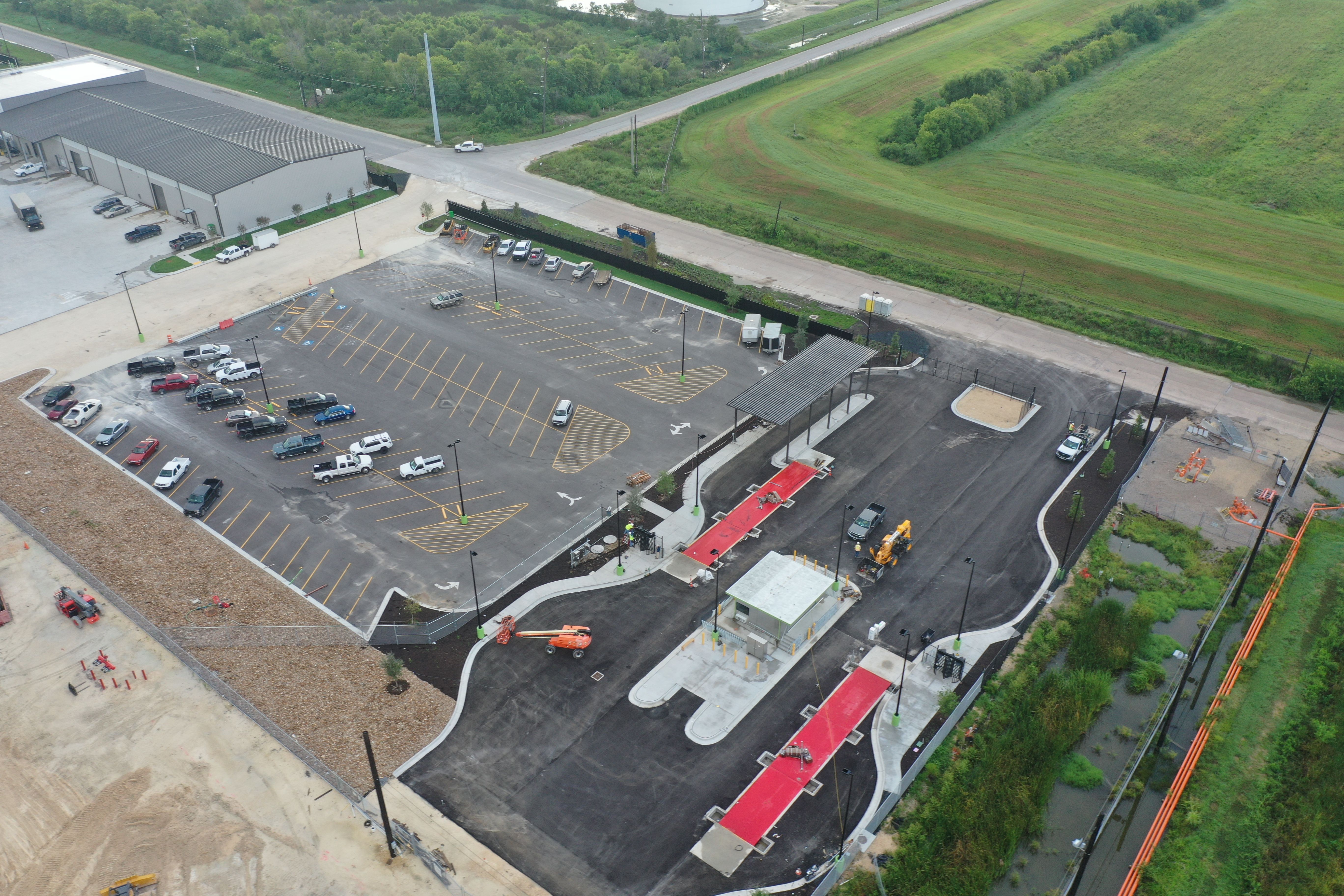 Aerial view of Valero DGD Site Package showing truck scales, guard station, and striped parking lot with concrete curbing